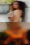 Naked woman playing guitar